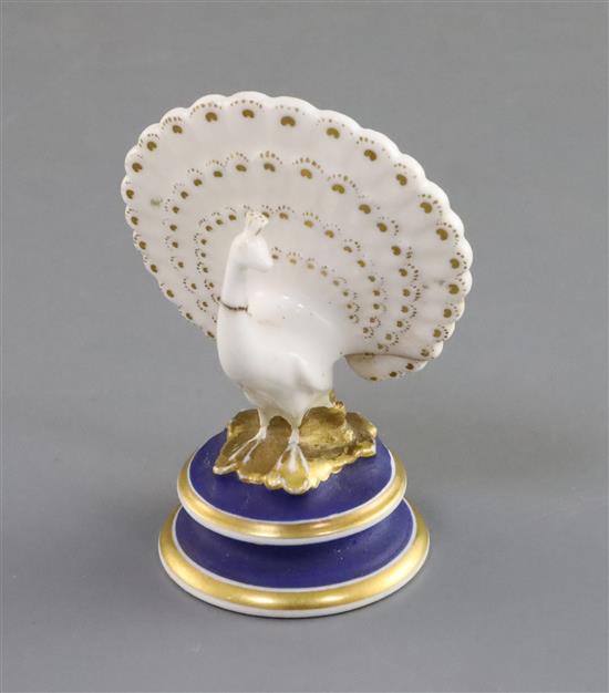 A Chamberlain Worcester porcelain figure of a peacock, c.1820-40, h. 8cm, repairs